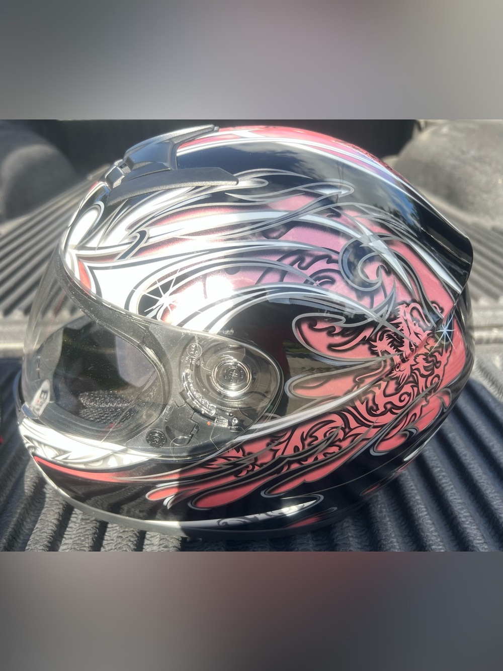 Pink and Black Full-Face Motorcycle Helmet - Stylish Graphic Design